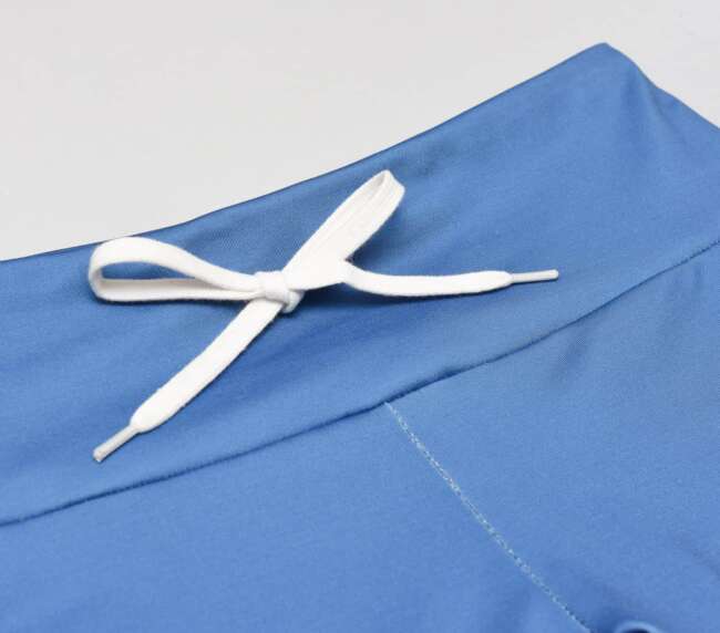 step-by-step sewing tutorial on how to add drawstrings to a leggings waistband